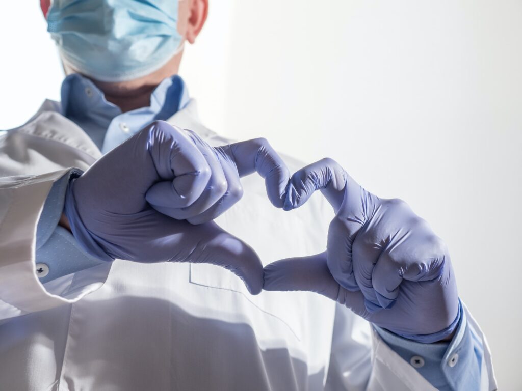 Doctor's hands showing heart sign
